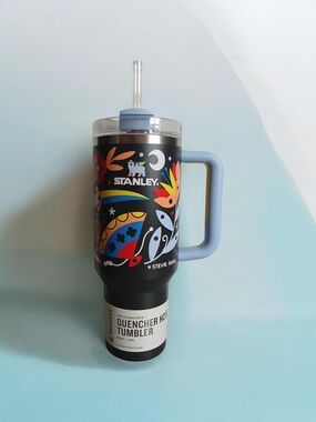 Stanley Black Tumbler with Light Blue Handle and Colorful Floral Graphic